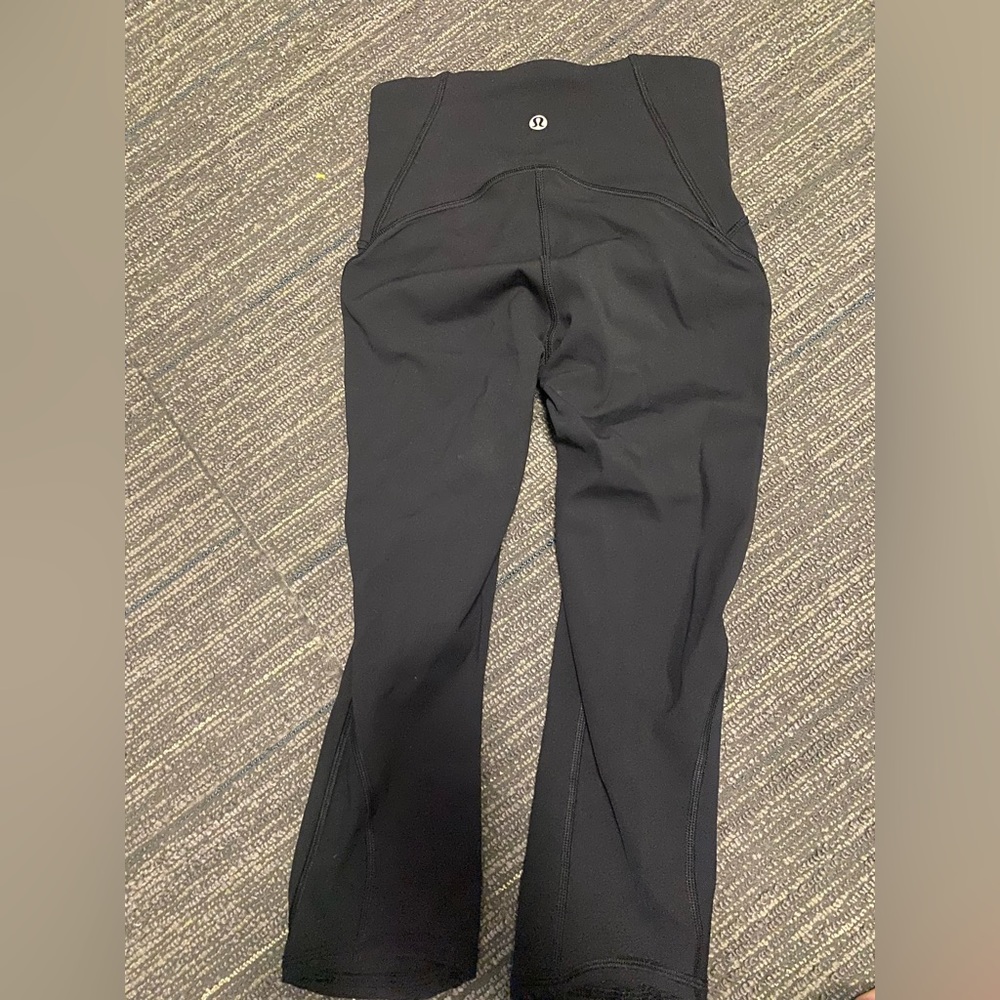 NWOT. Lululemon black capri compression pants with sheer side panel.